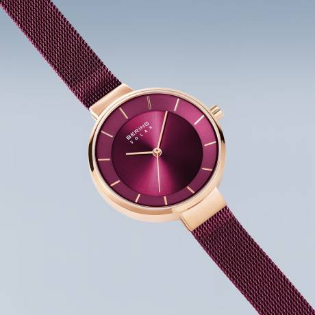 BERING - Montre solaire pour femme en acier inoxydable de 31 mm en or rose/violet