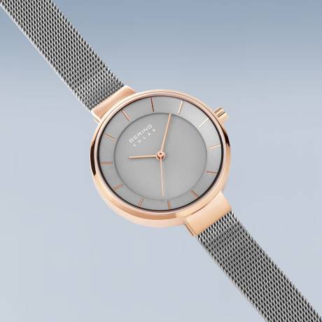 BERING - Montre solaire pour femme en acier inoxydable de 31 mm en or rose/violet