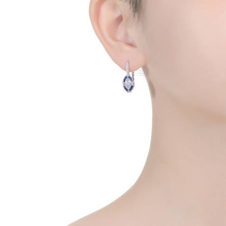 Genevive Sterling Silver White Gold Plated with Oval Sapphire Blue Cubic Zirconia Leverback Earrings